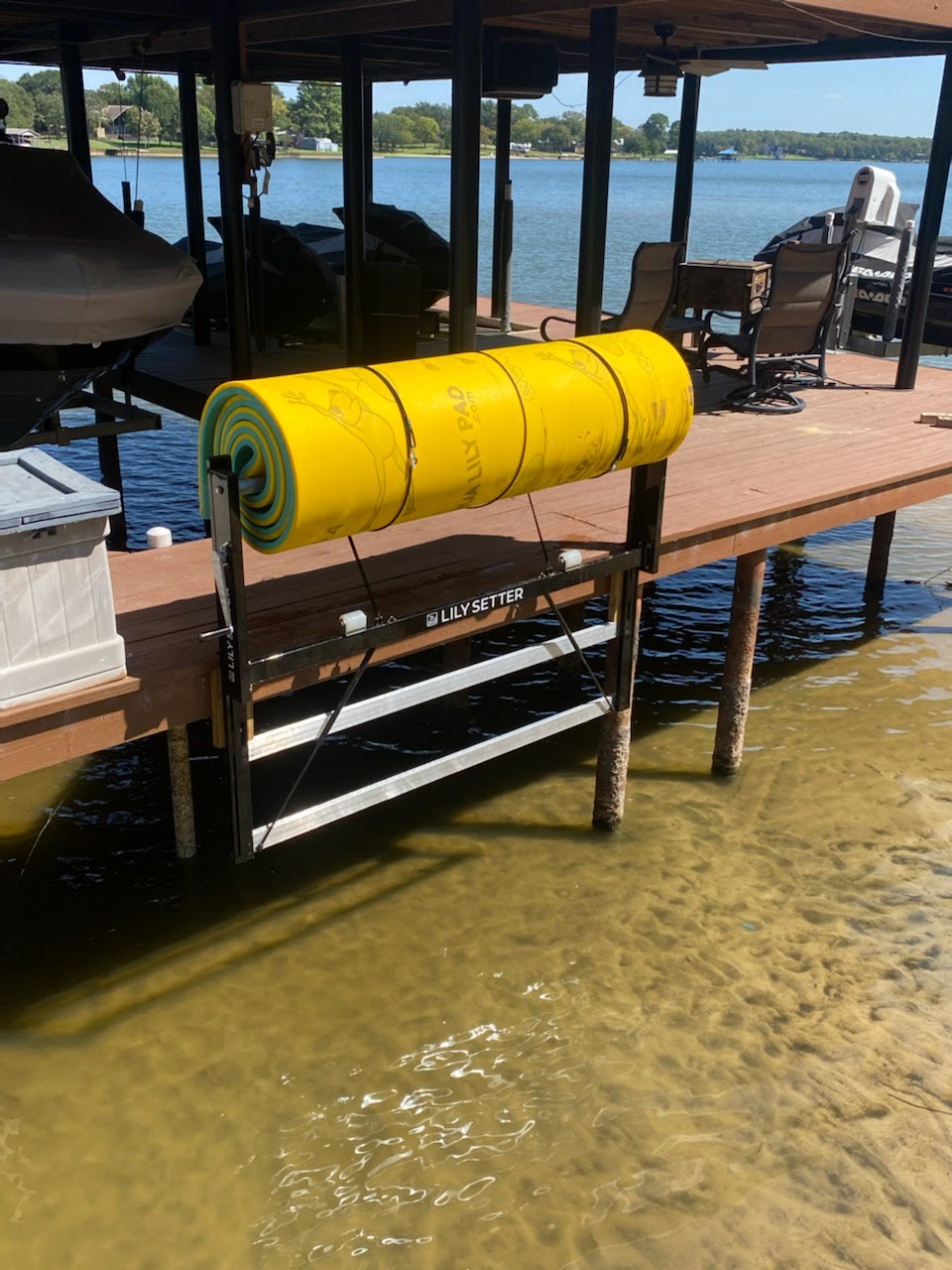 This is a picture of a Lily Pad that was easily rolled and stored on a dock using an ingenious invention by Lily Setter. It also shows that the device straps it. 